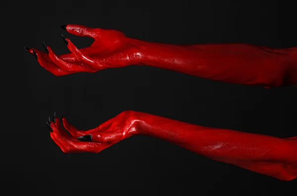 Red Devil's hands, red hands of Satan, Halloween theme, black background, isolated — Stock Photo, Image