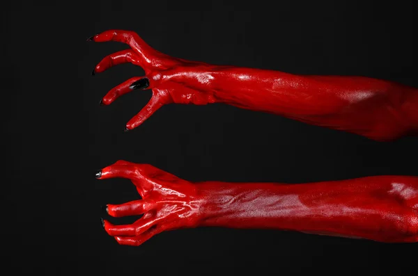 Red Devil 's hands, red hands of Satan, Halloween theme, black background, isolated — Stok Foto