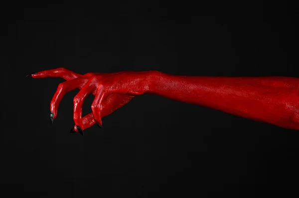 Mani del Diavolo Rosso, mani rosse di Satana, tema Halloween, sfondo nero, isolato — Foto Stock