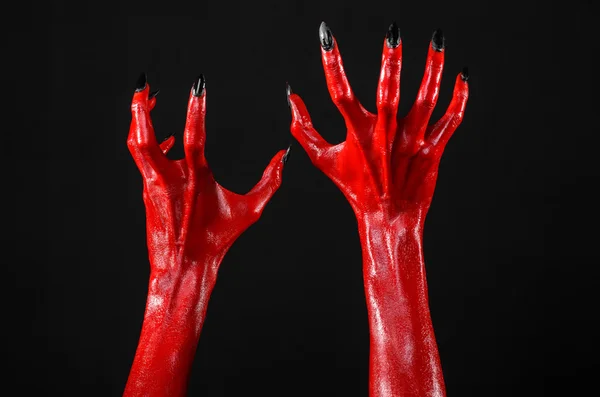 Mani del Diavolo Rosso, mani rosse di Satana, tema Halloween, sfondo nero, isolato — Foto Stock