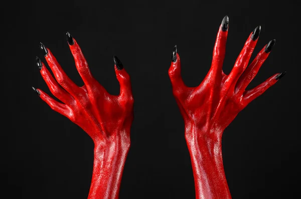 Red Devil ruce, červené ruce Satana, Halloween téma, černé pozadí, izolované — Stock fotografie