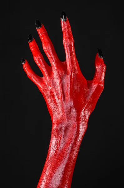 Mani del Diavolo Rosso, mani rosse di Satana, tema Halloween, sfondo nero, isolato — Foto Stock