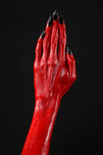 Mani del Diavolo Rosso, mani rosse di Satana, tema Halloween, sfondo nero, isolato — Foto Stock