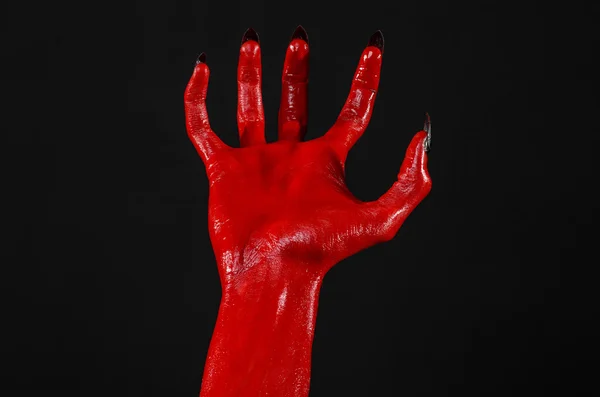 Mani del Diavolo Rosso, mani rosse di Satana, tema Halloween, sfondo nero, isolato — Foto Stock