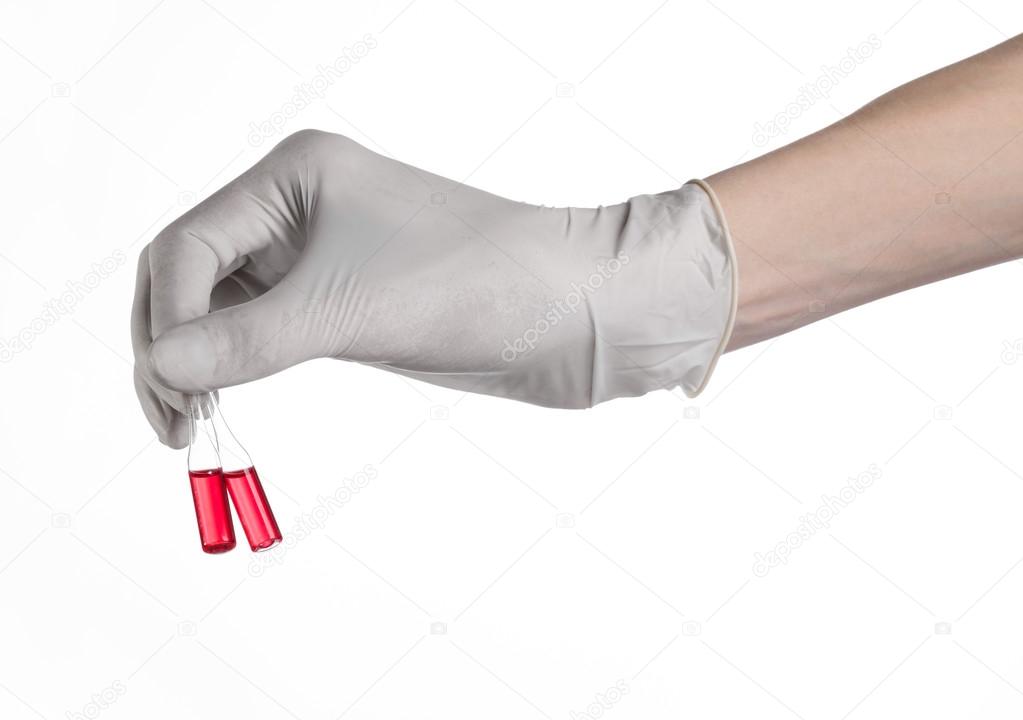 Doctor hand holding a vial, ampule red, vaccine ampule, Ebola vaccine, flu treatment, white background, isolated, gloved hand holding a vial, cancer vaccine, a vaccine against Ebola
