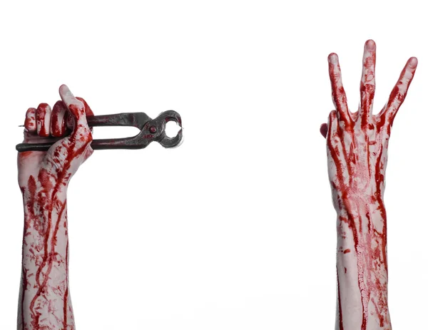 Halloween theme: bloody hand holding a pliers on a white background — Stock Photo, Image