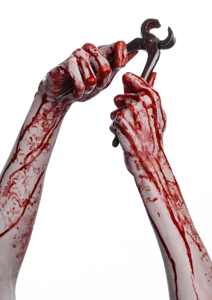 Halloween theme: bloody hand holding a pliers on a white background — Stock Photo, Image