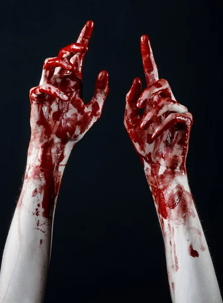 Bloody halloween theme: bloody hands killer zombie isolated on black background in studio — Stock Photo, Image