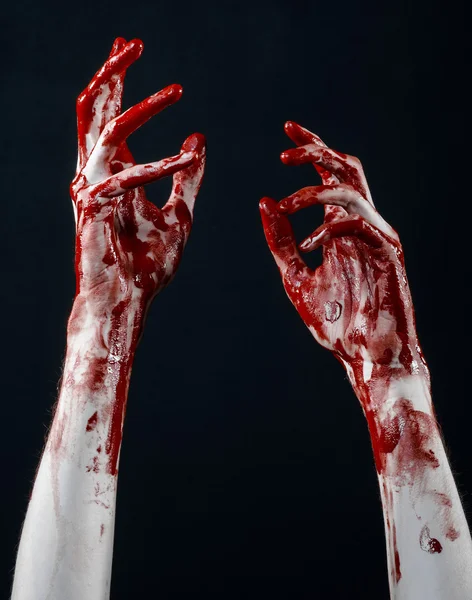 Bloody halloween theme: bloody hands killer zombie isolated on black background in studio — Stock Photo, Image