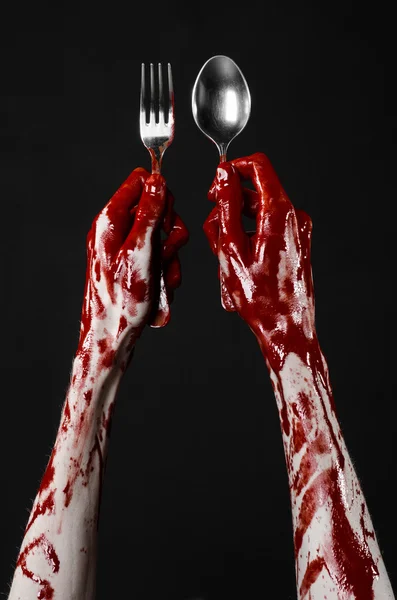 Bloody hand holding a spoon, fork, halloween theme, bloody spoon, fork, black background, isolated — Stock Photo, Image