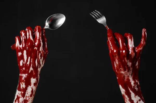 Bloody hand holding a spoon, fork, halloween theme, bloody spoon, fork, black background, isolated — Stock Photo, Image