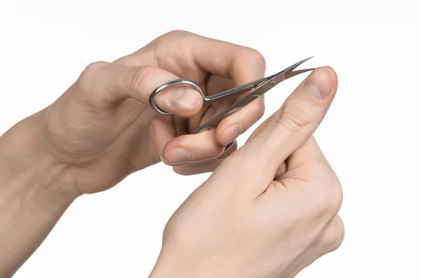 Gezondheid en persoonlijke verzorging: Hand houden schaar voor manicure geïsoleerd op witte achtergrond — Stockfoto