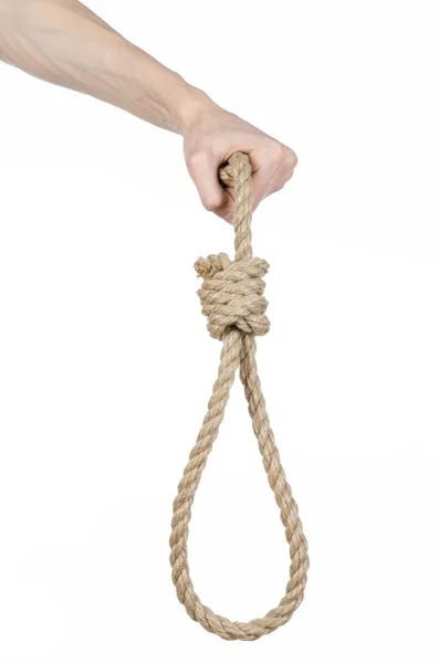 Linchamento e suicídio tema: mão do homem segurando um laço de corda para pendurar em fundo isolado branco — Fotografia de Stock