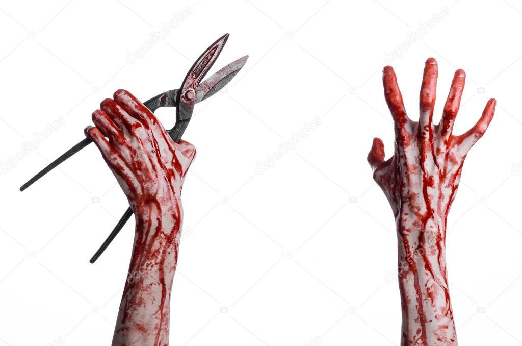 Halloween theme: bloody hand holding a big old bloody scissors on a white background