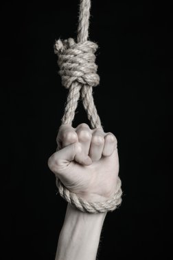 Depresyon ve intihar Konu: insan eli ip döngü siyah bir arka plan asılı