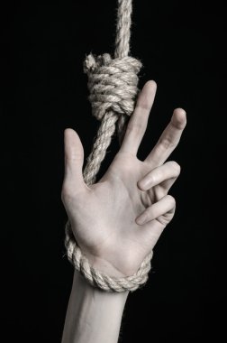 Depresyon ve intihar Konu: insan eli ip döngü siyah bir arka plan asılı