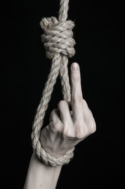 Depresyon ve intihar Konu: insan eli ip döngü siyah bir arka plan asılı