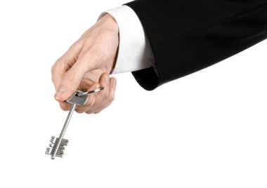 İş Tema: emlakçı elinde beyaz üzerine yeni bir daire anahtarı ceketli izole arka plan