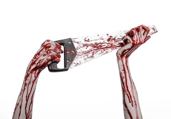 Halloween theme: bloody hand holding a bloody saw on a white background — Stock Photo, Image