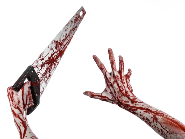 Halloween theme: bloody hand holding a bloody saw on a white background — Stock Photo, Image
