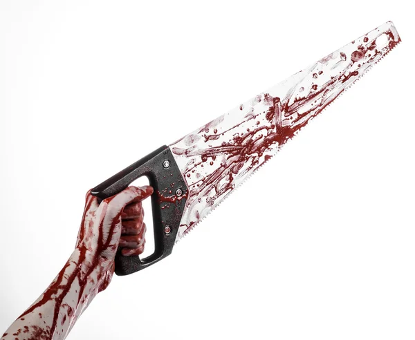 Halloween theme: bloody hand holding a bloody saw on a white background — Stock Photo, Image