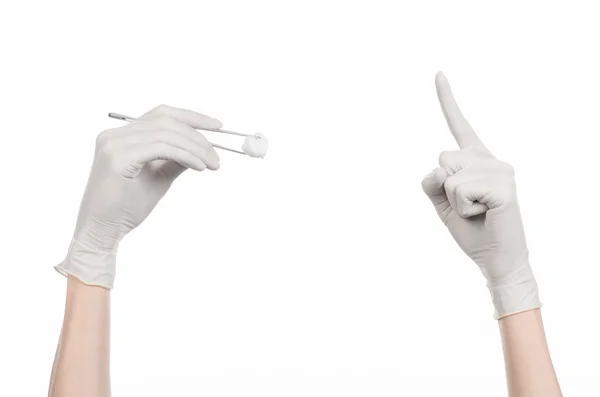 Medicine and Surgery theme: doctor's hand in a white glove holding tweezers with swab isolated on white background in studio — Stock Photo, Image