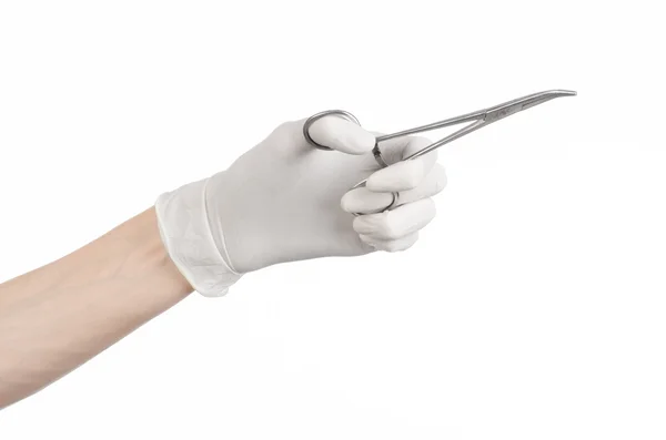 Surgery and Medical theme: doctor's hand in a white glove holding a surgical clip isolated on white background — Stock Photo, Image