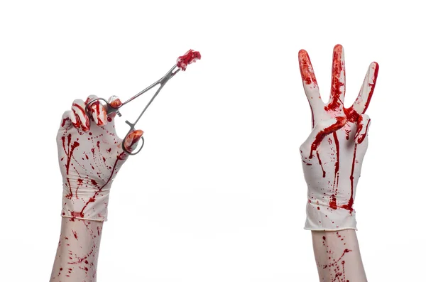 Surgery and medicine theme: doctor bloody hand in glove holding a bloody surgical clamp with swab and performs surgery on an isolated white background in studio — Stock Photo, Image