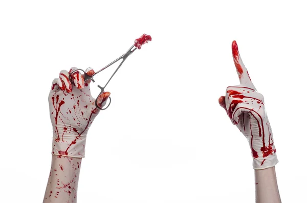 Surgery and medicine theme: doctor bloody hand in glove holding a bloody surgical clamp with swab and performs surgery on an isolated white background in studio — Stock Photo, Image