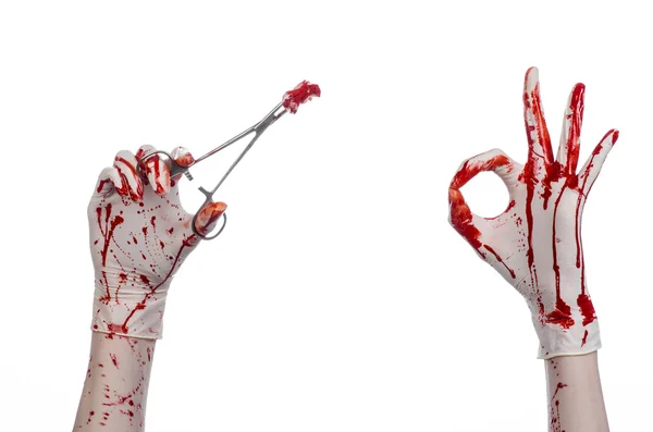 Surgery and medicine theme: doctor bloody hand in glove holding a bloody surgical clamp with swab and performs surgery on an isolated white background in studio — Stock Photo, Image