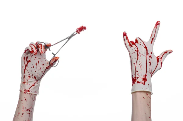 Surgery and medicine theme: doctor bloody hand in glove holding a bloody surgical clamp with swab and performs surgery on an isolated white background in studio — Stock Photo, Image