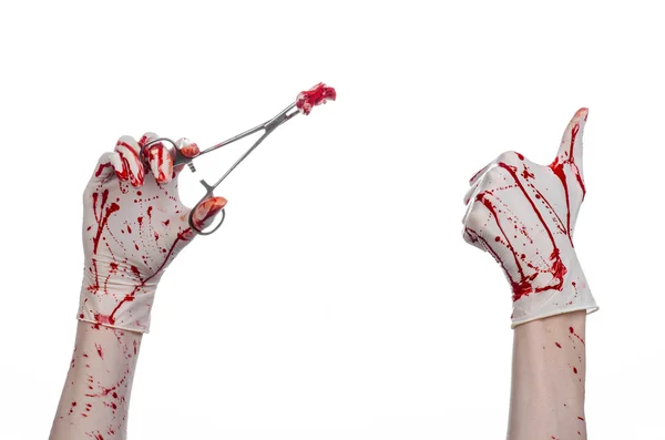 Surgery and medicine theme: doctor bloody hand in glove holding a bloody surgical clamp with swab and performs surgery on an isolated white background in studio — Stock Photo, Image