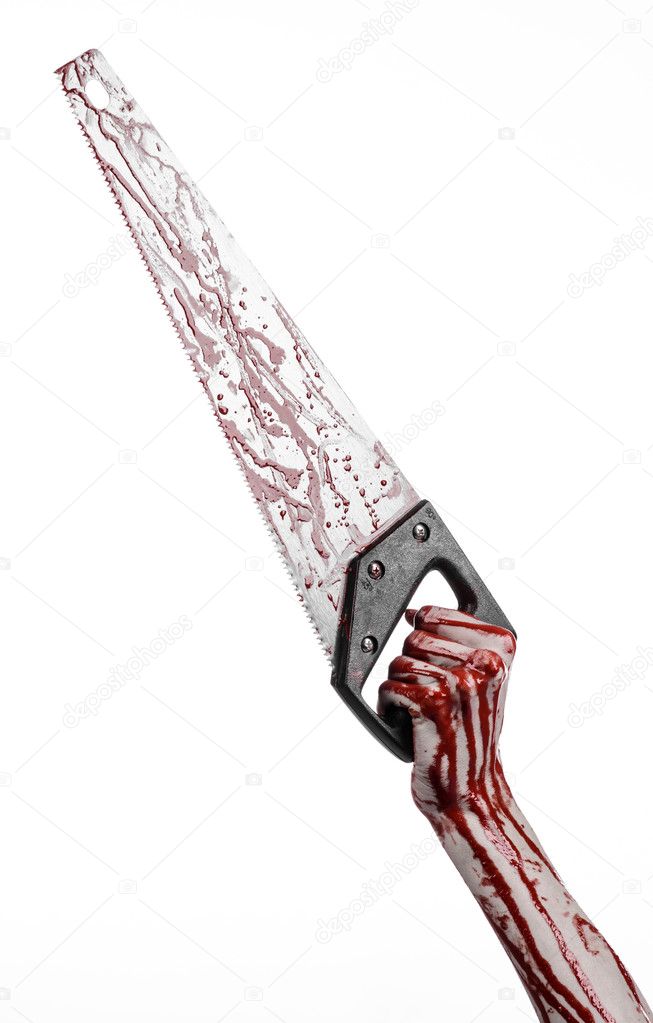 Halloween theme: bloody hand holding a bloody saw on a white background