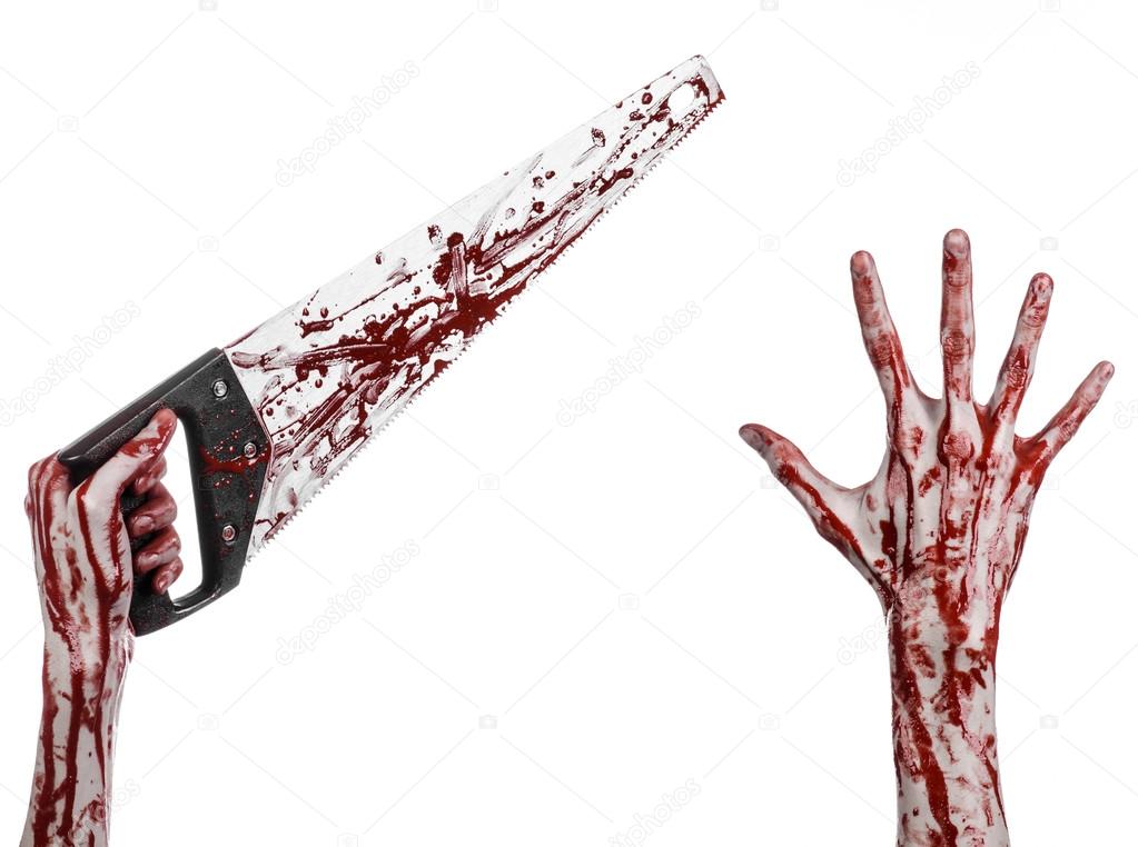 Halloween theme: bloody hand holding a bloody saw on a white background