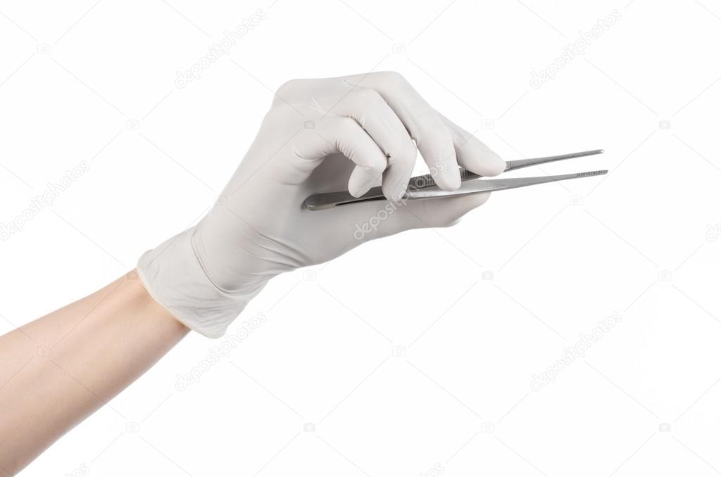 Medicine and Surgery theme: doctor's hand in a white glove holding tweezers isolated on white background