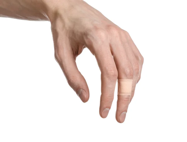Medicinska tema: för en man hand limmade medicinska gips första hjälpen gips reklam på vit bakgrund — Stockfoto