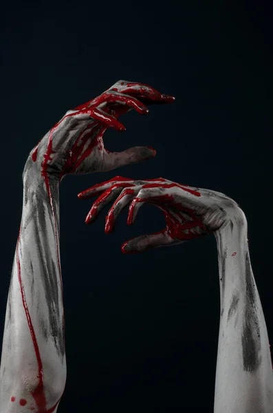 Bloody Halloween theme: horrible zombie demon bloody hands on a black background — Stock Photo, Image