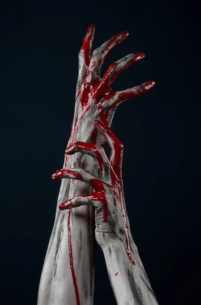 Bloody Halloween theme: horrible zombie demon bloody hands on a black background — Stock Photo, Image