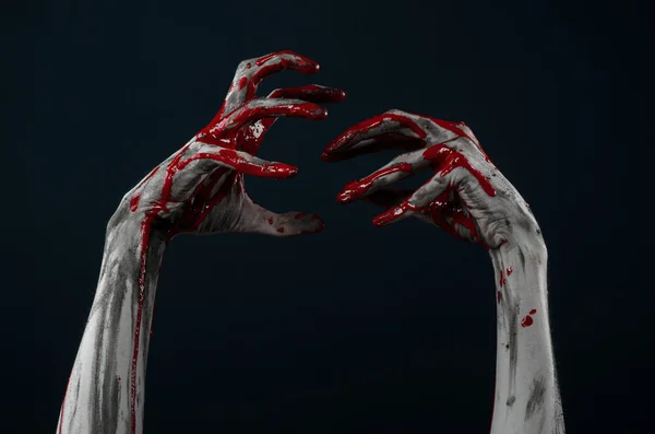 Bloody Halloween theme: horrible zombie demon bloody hands on a black background — Stock Photo, Image