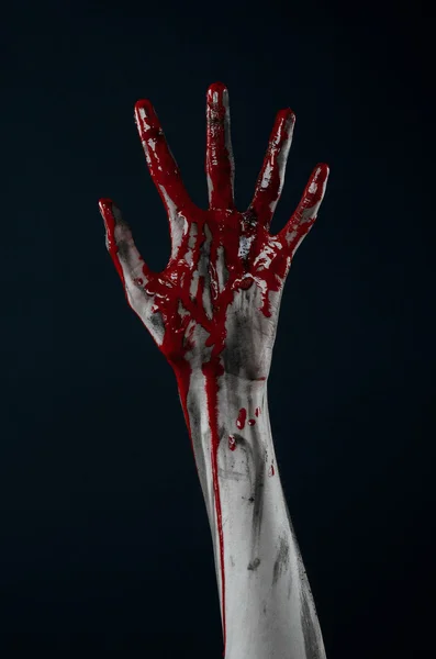 Bloody Halloween theme: horrible zombie demon bloody hands on a black background — Stock Photo, Image