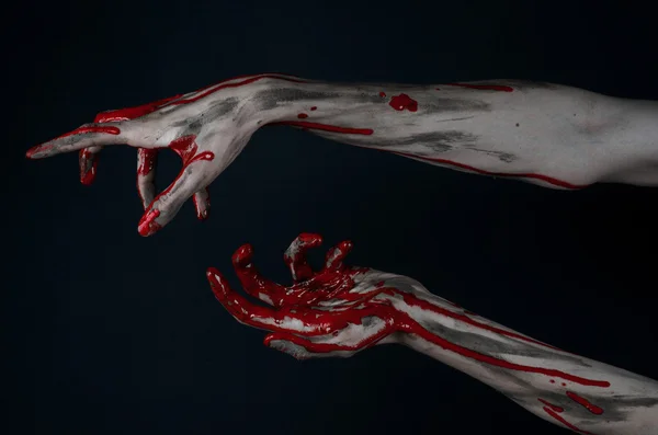 Bloody Halloween theme: horrible zombie demon bloody hands on a black background — Stock Photo, Image