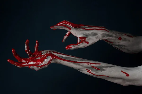 Bloody Halloween theme: horrible zombie demon bloody hands on a black background — Stock Photo, Image