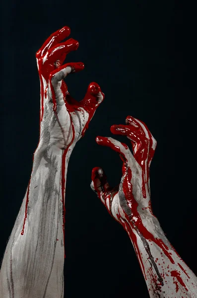 Bloody Halloween theme: horrible zombie demon bloody hands on a black background — Stock Photo, Image