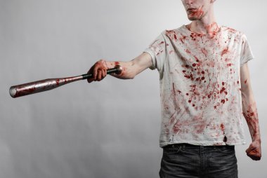 Kanlı Konu: kanlı bir yarasa beyaz bir arka plan üzerinde tutarak Kanlı tişört giyen