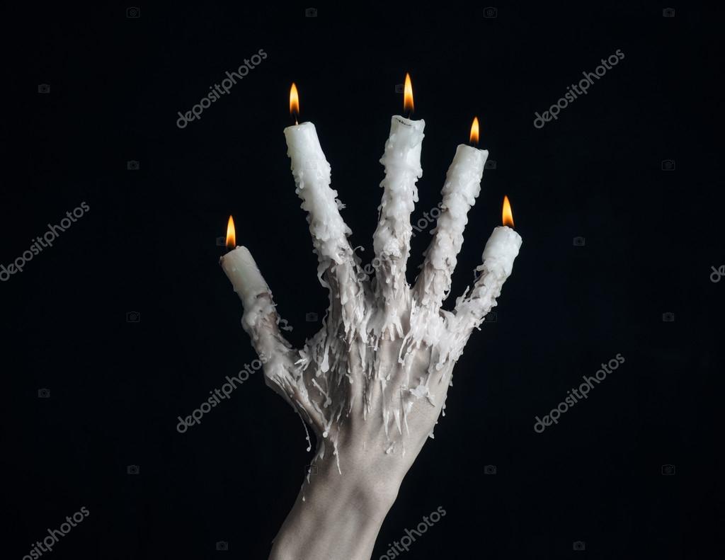 Halloween Theme On The Hand Wearing A Candle And Dripping Melted Halloween Theme On The Hand Wearing A Candle And Dripping Melted