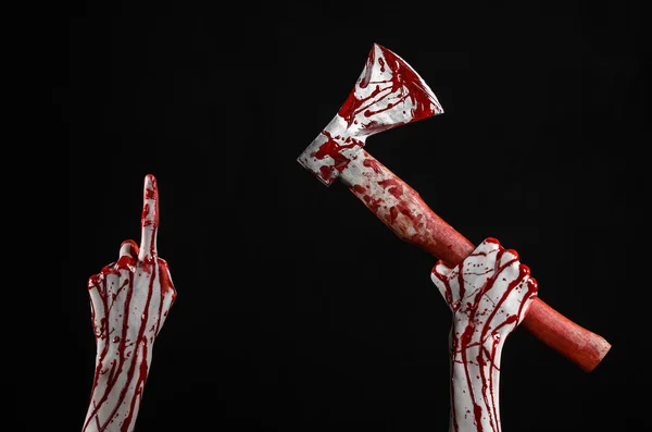 Bloody Halloween theme: bloody hand holding a bloody butcher's ax isolated on black background in studio — Stock Photo, Image