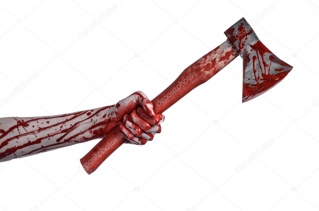 Bloody Halloween theme: bloody hand holding a bloody butcher's ax isolated on white background in studio