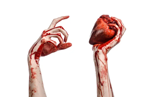 Blood and Halloween theme: terrible bloody hand hold torn bleeding human heart isolated on white background in studio — Stock Photo, Image
