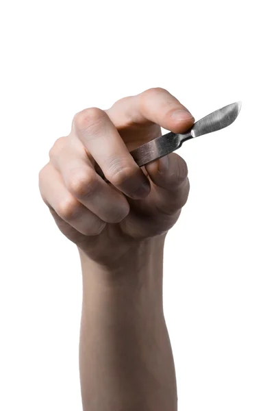 The hand holding the scalpel, white background, isolated — Stock Photo, Image