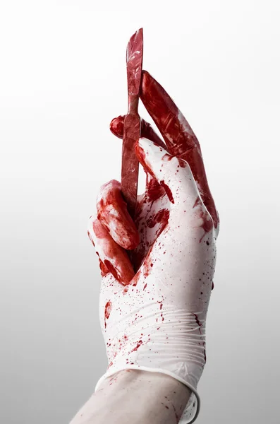 Bloody hands in gloves with the scalpel, white background, isolated, doctor, killer, maniac — Stock Photo, Image